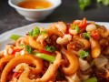 铁锅鱿鱼头的制作方法（传统美食的经典口味，简单易学，美味可口）