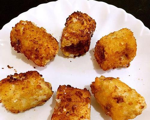 酥炸香蕉的制作方法详解（如何做出口感酥脆、内部柔软的香蕉甜点）-第3张图片-美味行家