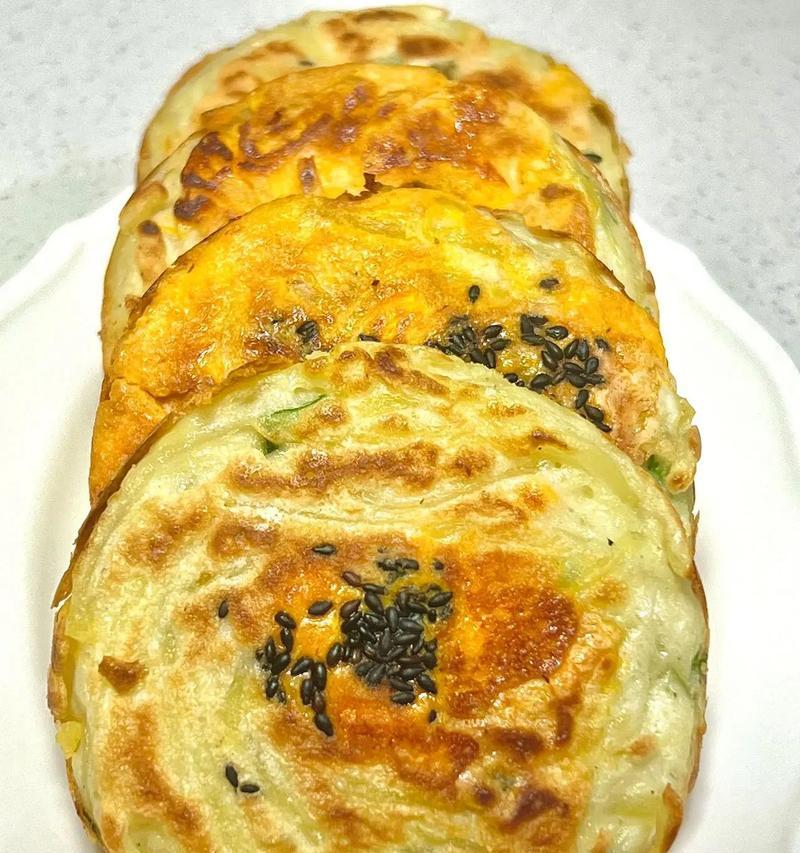 双色鸡蛋饼制作方法大揭秘（用双色鸡蛋制作香脆美味的鸡蛋饼，让你赞不绝口）-第2张图片-美味行家